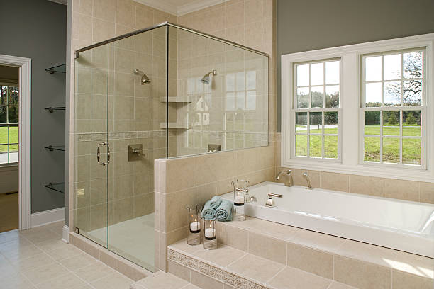 istock Master bathroom tub and glass shower. 173881385