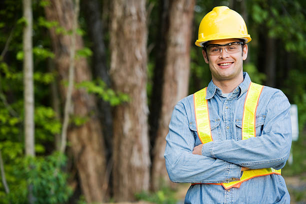 Man Wearing Hard Hat and Safety Vest stock photo