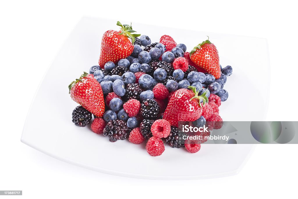 Fresh berries "Fresh berries' fruit salad, isolated on white background. Studio shot." Beauty In Nature Stock Photo