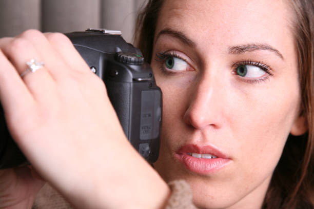 istock Attractive Caucasian Woman Using Her Camera 173881755