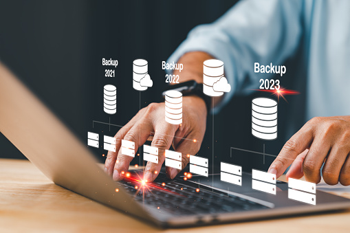 Database administrators backup company and customer data concept. Databases, computer, DBMS, DBA, database, SQL, and cloud stored. Software engineering is restoring data to servers. black background