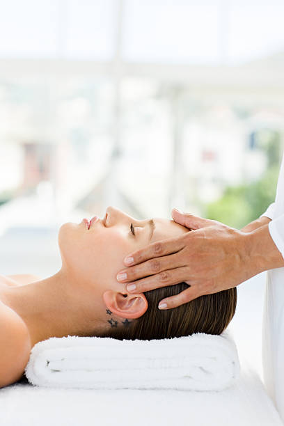 istock Young woman receiving head massage 173882379