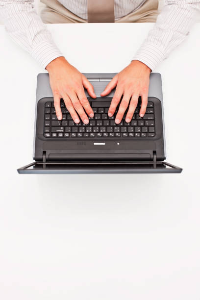 istock Human hands working on a laptop at desk 173882693