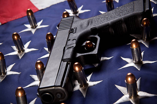 istock Pistol and bullets on flag (horizontal) 173883071