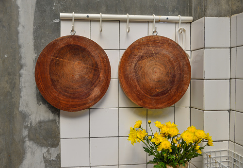 Set of two cutting board hanging on the wall at countryside house in Dalat, Vietnam.