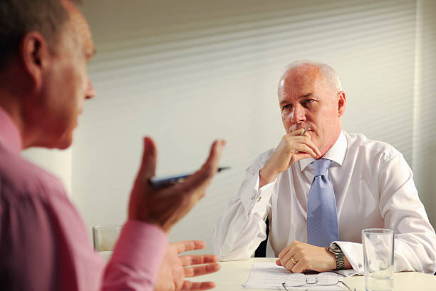 istock senior business men in meeting 173884116