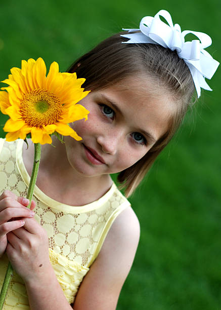 istock Little Girl with Sunflower 173884145