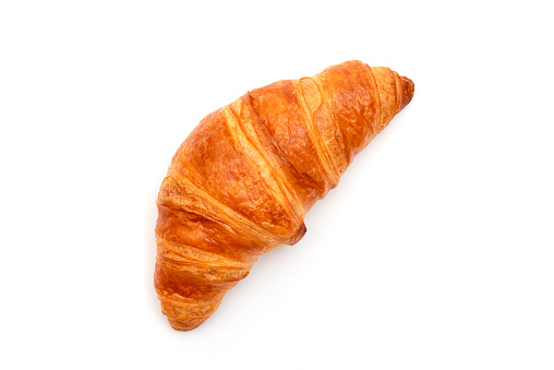 Fresh croissant isolated on white background. French pastries.