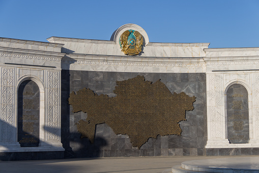 Atyrau, Kazakhstan (Qazaqstan), 03.09.2023 - State symbols of the Republic of Kazakhstan - Coat of arms, Anthem and map of the Republic of Kazakhstan