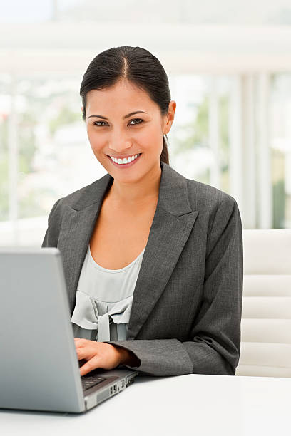 istock Young business woman working on a laptop 173885369