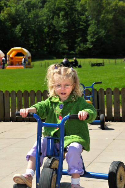 istock little girl on tricycle 173886286