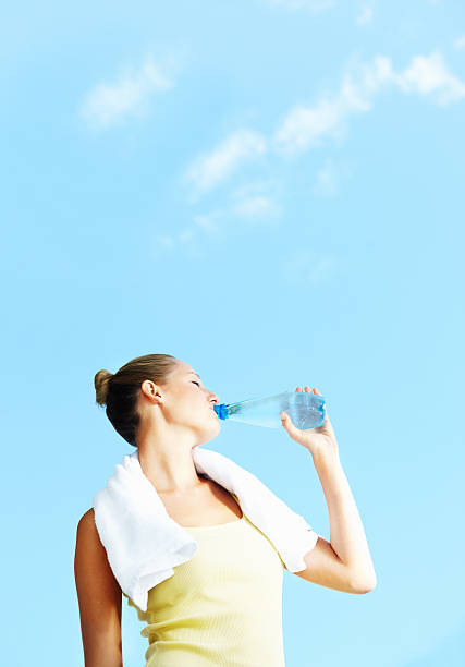 istock Young woman drinking water 173887317