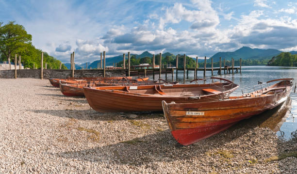 istock Classic row boats on idyllic lake shore 173887363