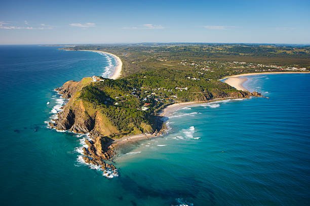 Byron Bay Aerial View Byron Bay headland in the morning. lighthouse vacation stock pictures, royalty-free photos & images