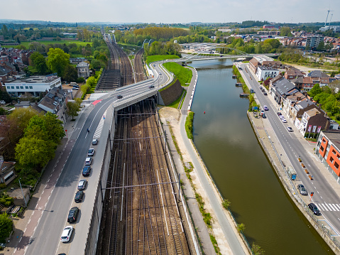 Halle, Flemish Brabant Region, Belgium, 01 05 2023, aerial top down view of the railway station and the sea canal in the city of Halle on a sunny spring day. High quality photo. High quality photo