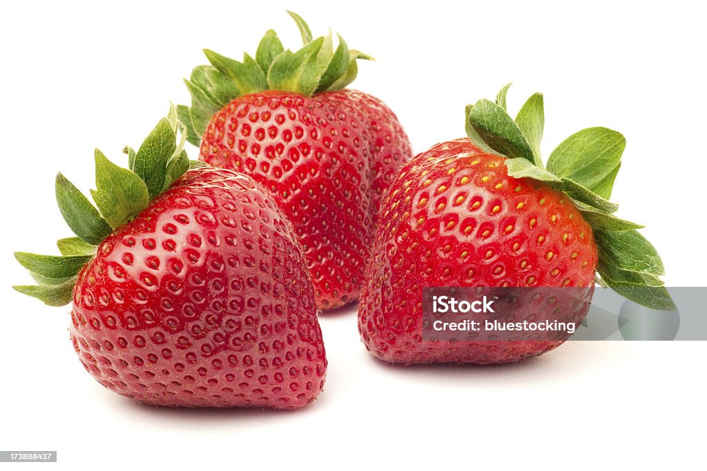 Strawberries Three fresh ripe red strawberries, isolated on white with soft shadow. Strawberry Stock Photo