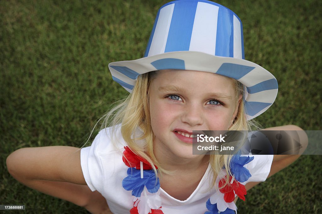 Red, White & Blue Girl A girl wearing a top hat and lei 6-7 Years Stock Photo