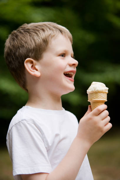 istock Child Laughing Eating Ice Cream Lifestyle 173889234