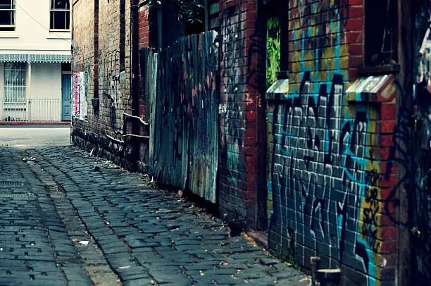 Inner-city laneway with graffiti. Cross-processed.