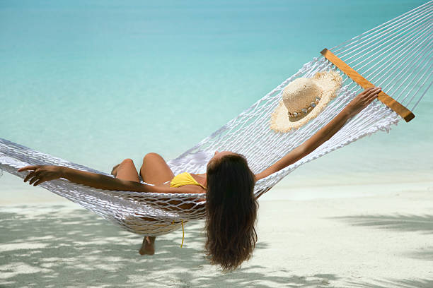 istock woman in hammock on the beach 173889717
