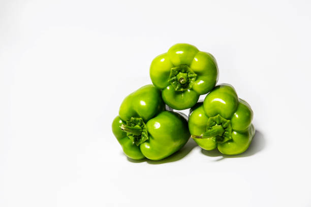 green bell peppers isolated on white background