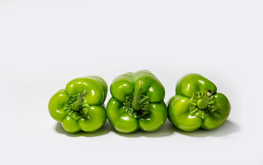 green bell peppers isolated on white background