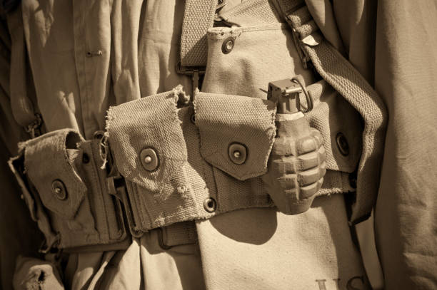 Close up of World War II soldier's uniform with belt and hand grenade. This uniform was also used during World War I.