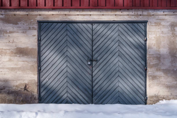 istock Blue wooden basement doors with in winter. 1738901922