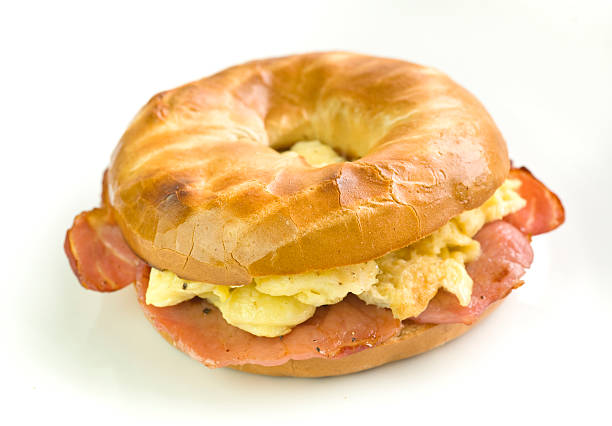 Bacon and Scrambled egg filled bagel stock photo