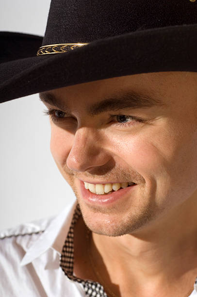 istock Young cowboy wearing black  hat 173890615