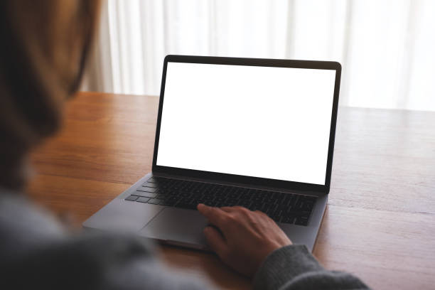 istock Mockup image of a woman using and working on laptop computer with blank white desktop screen 1738908042