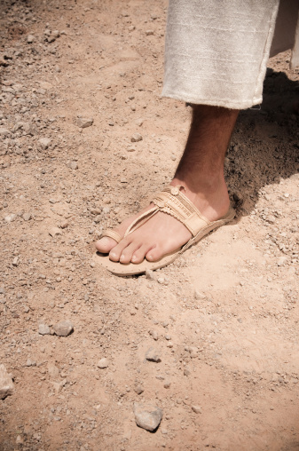 A man wearing old sandals and robe.  Similar images:
