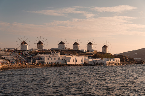 sunset at mykonos windmills in front of little venice harbor, Fabrica, Chora, Greece