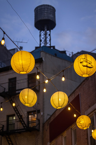 Hanging lanterns glow over Doyers Street in Chinatown, NYC