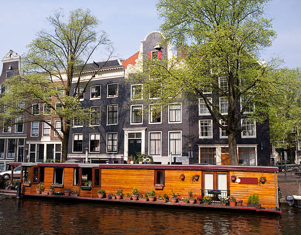 istock Houseboat on Amsterdam Canal 173892471