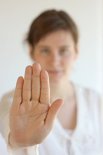 istock young woman saying stop 173892688