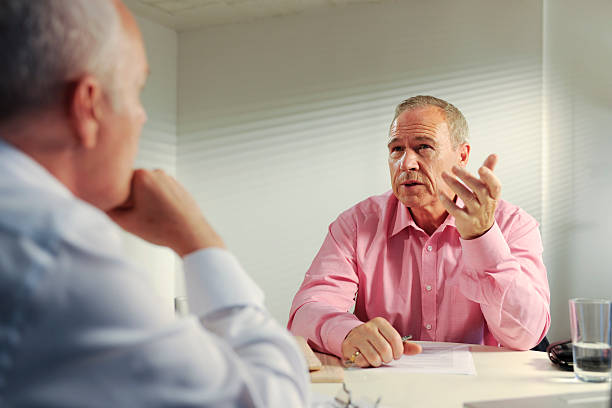 istock senior business men in meeting 173892848