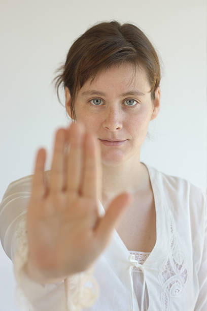 istock young woman saying stop 173893169