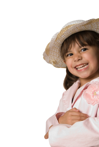 Cute laughing child baby girl in white flower hat portrait