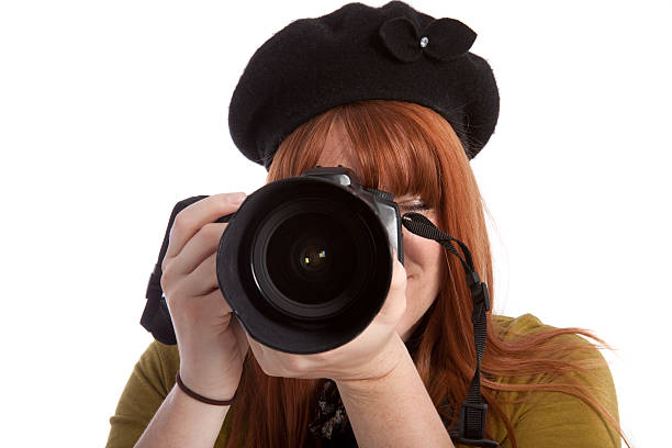 istock Female Photographer with Digital SLR Camera Isolated on White 173893532