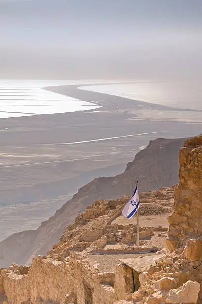 "Looking to the Dead Sea from Masada, Israel.  Israeli flag in the foreground"
