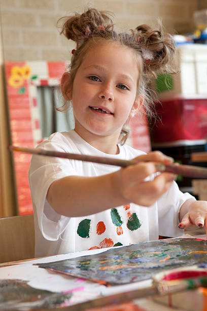 istock Little child painting 173894470