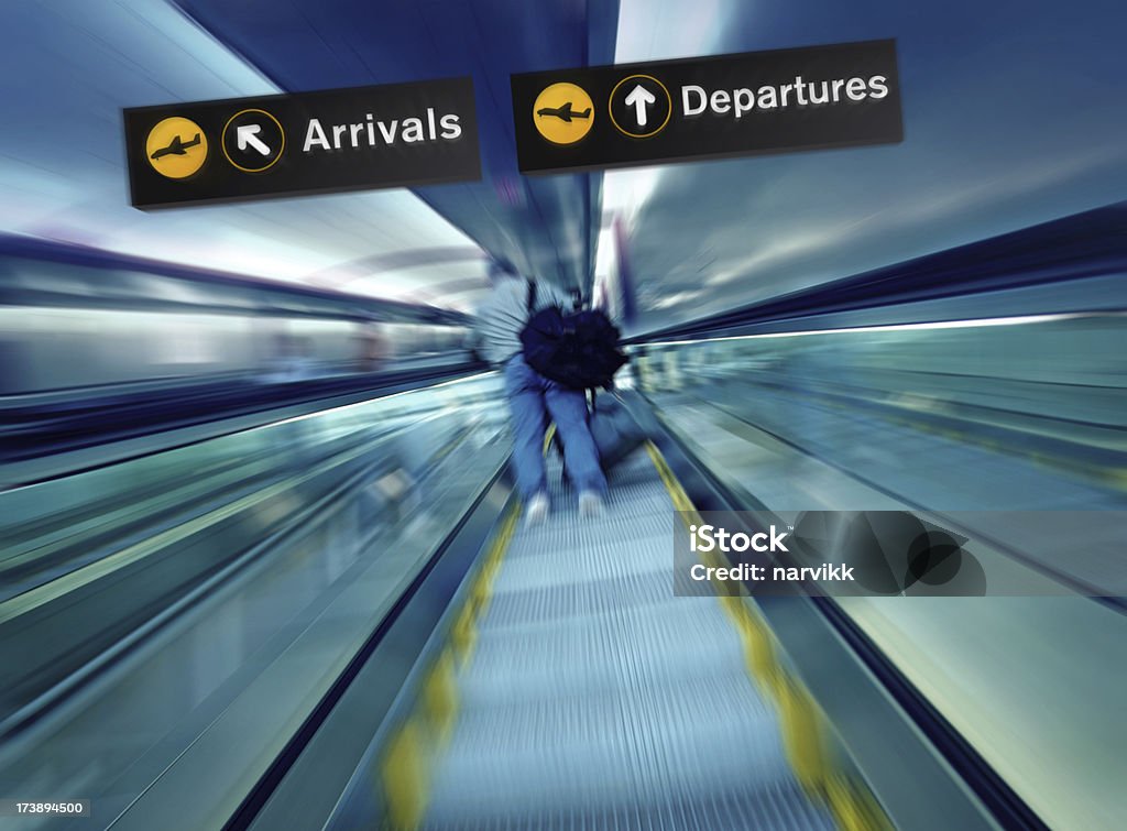 Person Going Up on Escalator at the Airport Escalator at the Airport Moving Up, Blurred Motion Effect. Activity Stock Photo