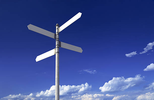 istock Sign post with four blank signs on a blue sky 173894724