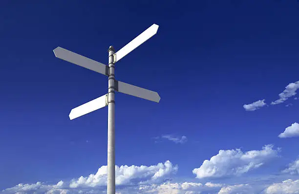 Blank signpost with four arrows over partly cloudy blue sky - just add your text.