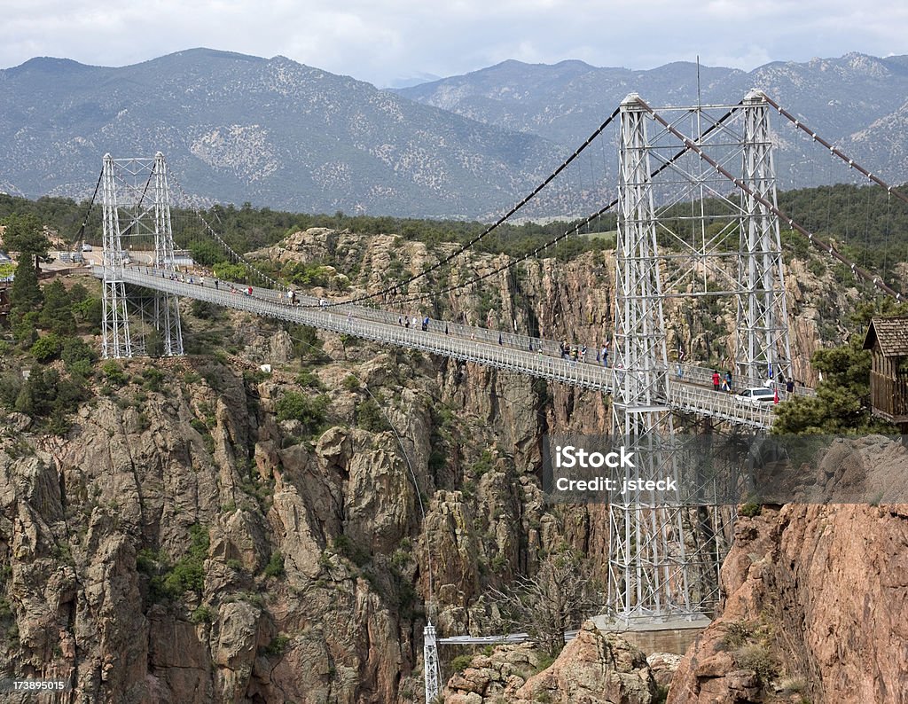 Colorado Suspension Bridge A suspension bridge dramatically spans a canyon in Colorado. Royal Gorge Suspension Bridge Stock Photo