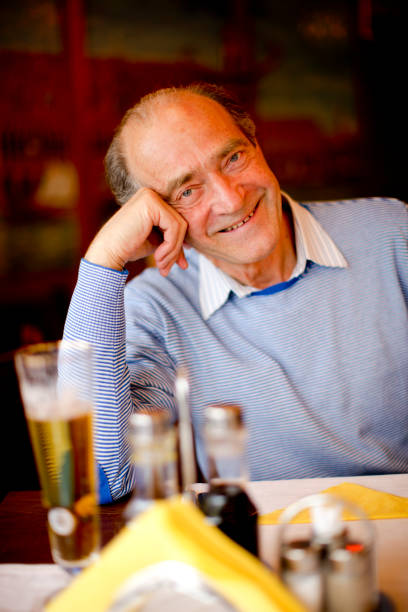 istock Happy Senior Man in restaurant 173895065