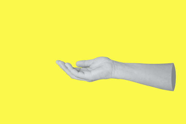istock Woman hand gesture holding something isolated on yellow background 1738950672