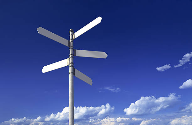 Signpost with three blank signs on sky backgrounds Blank signpost with five arrows over partly cloudy blue sky - just add your text. crossroads sign stock pictures, royalty-free photos & images