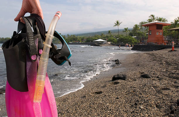 Snorkler at Kahaluu Beach Park, Kona Hawaii stock photo